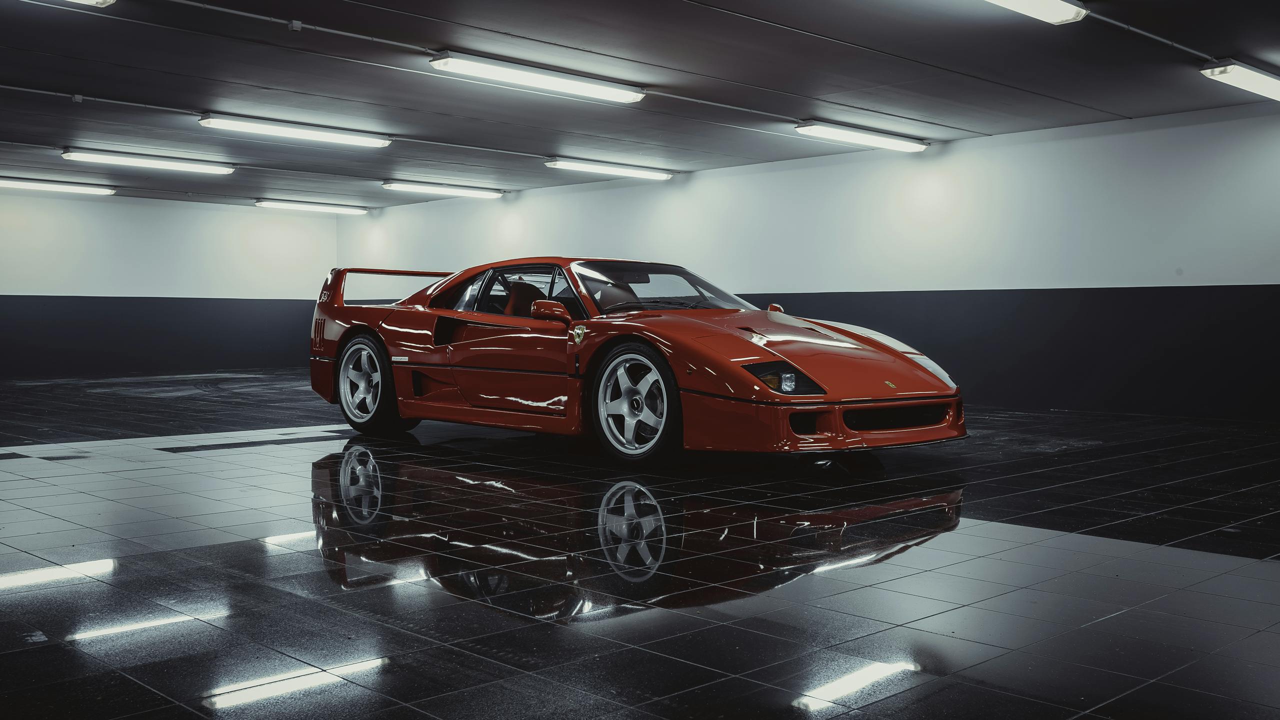 Stunning red Ferrari sports car showcased in a sleek indoor parking area.